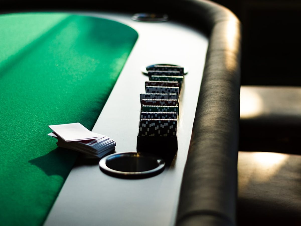 A blackjack table with cards and chips
