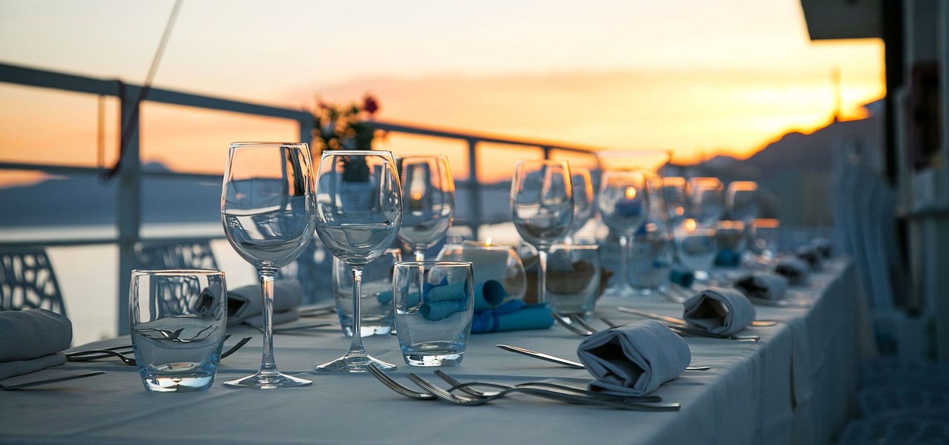 A table laid on the veranda at Moturiki as the sun drops