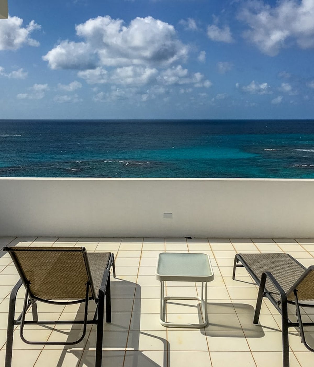 Chairs on a veranda looking to the sea