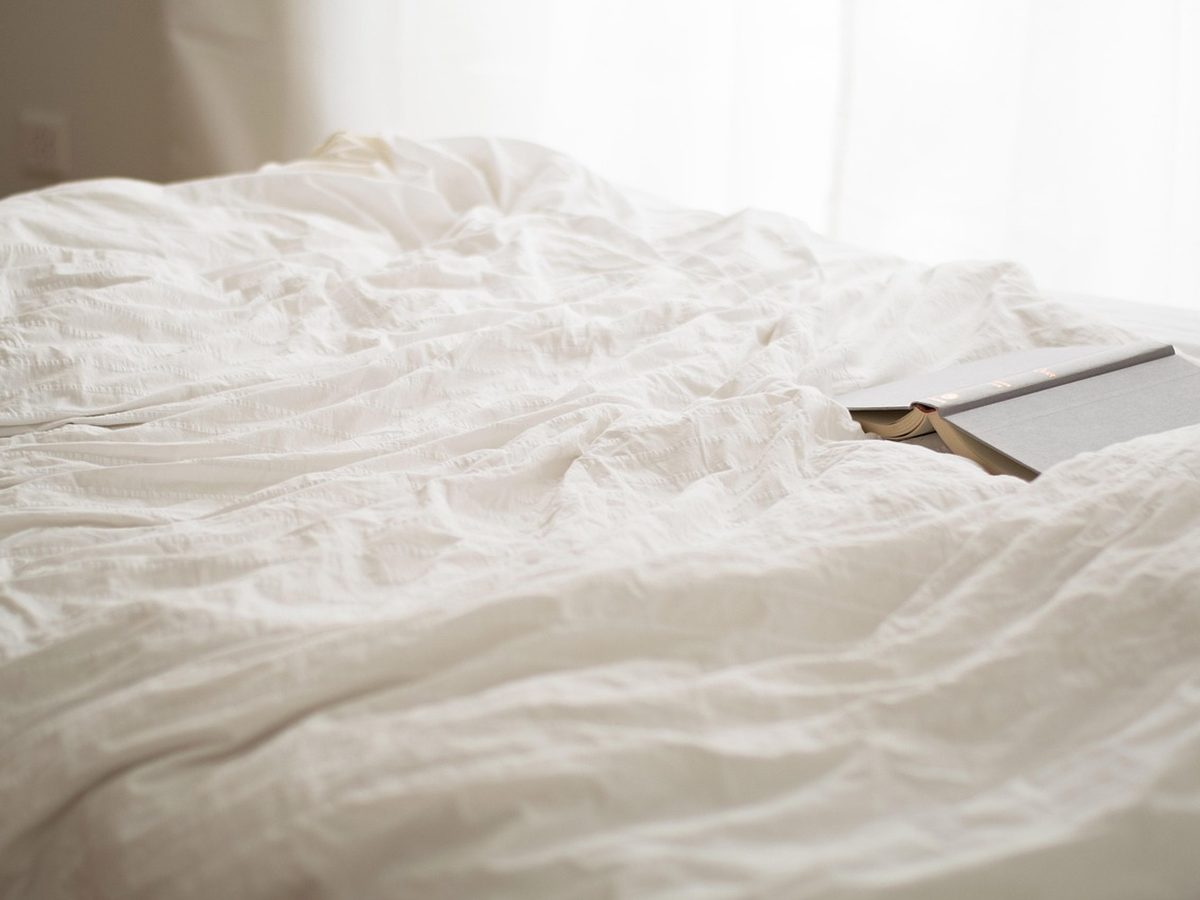 A made bed at Tidal Veranda in morning light