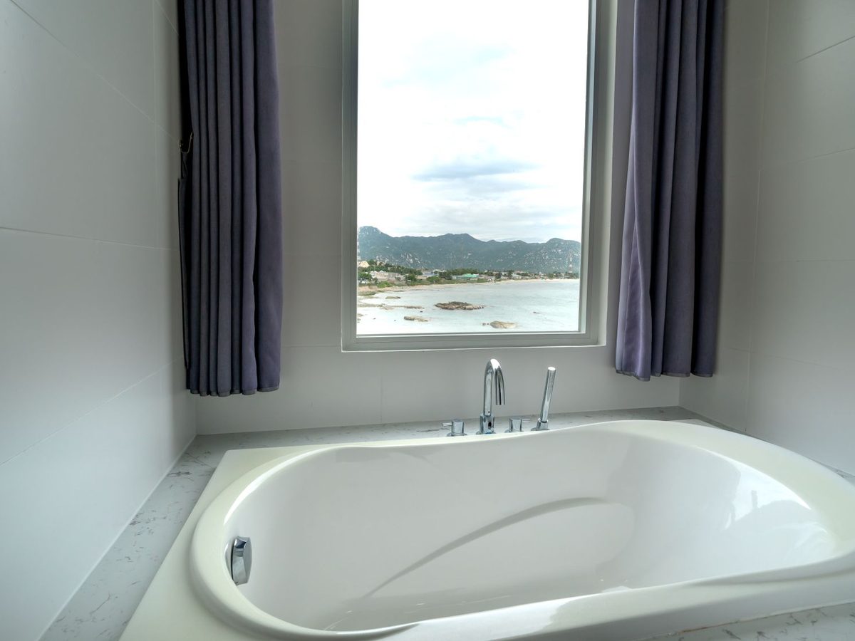 A bathroom at Tidal Veranda with a window looking to the coast