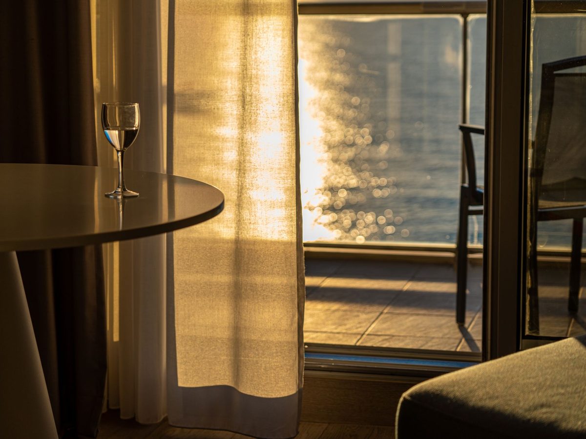A Veranda King room with the balcony doors open
